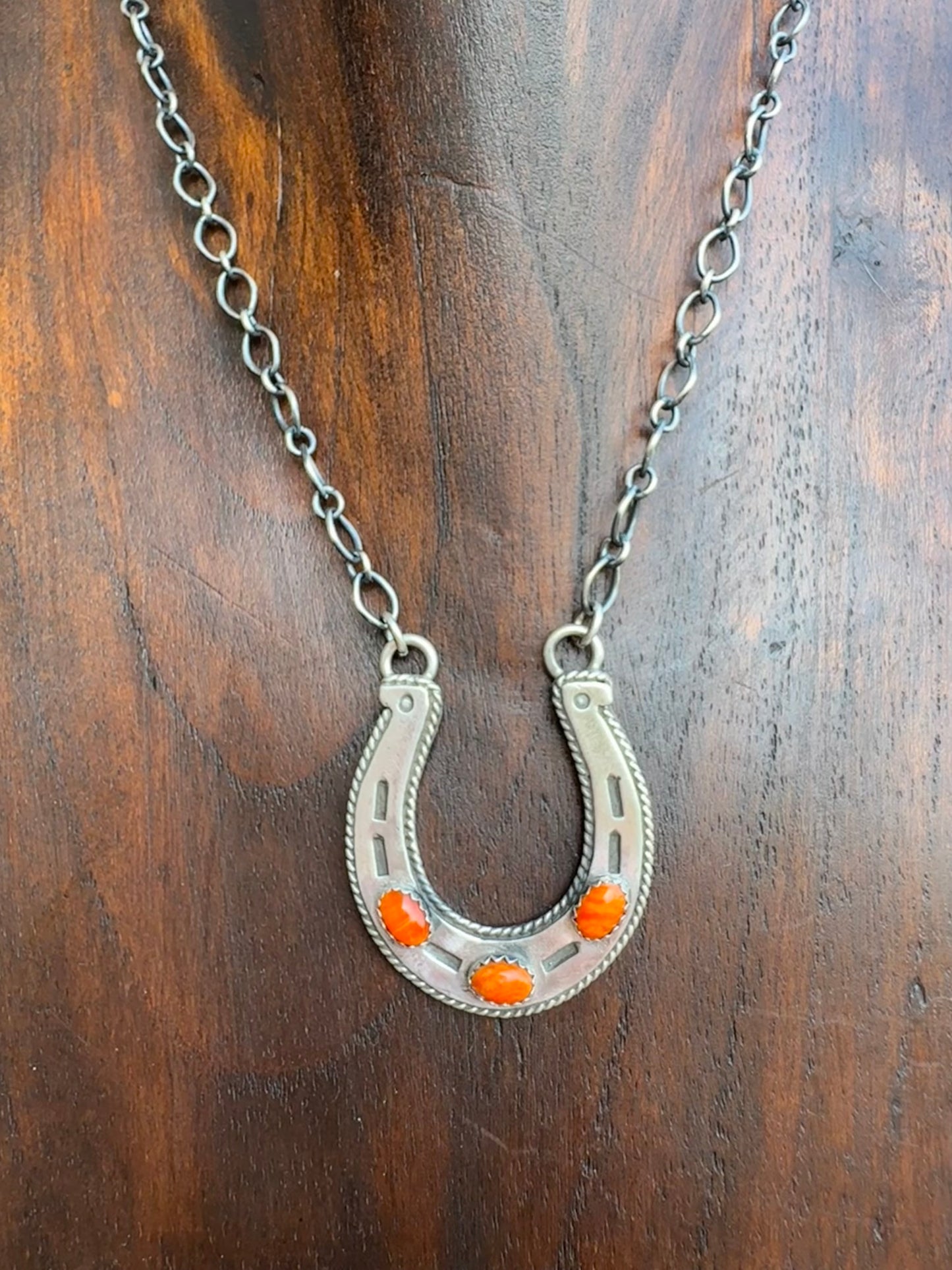 Orange spiny horseshoe necklace